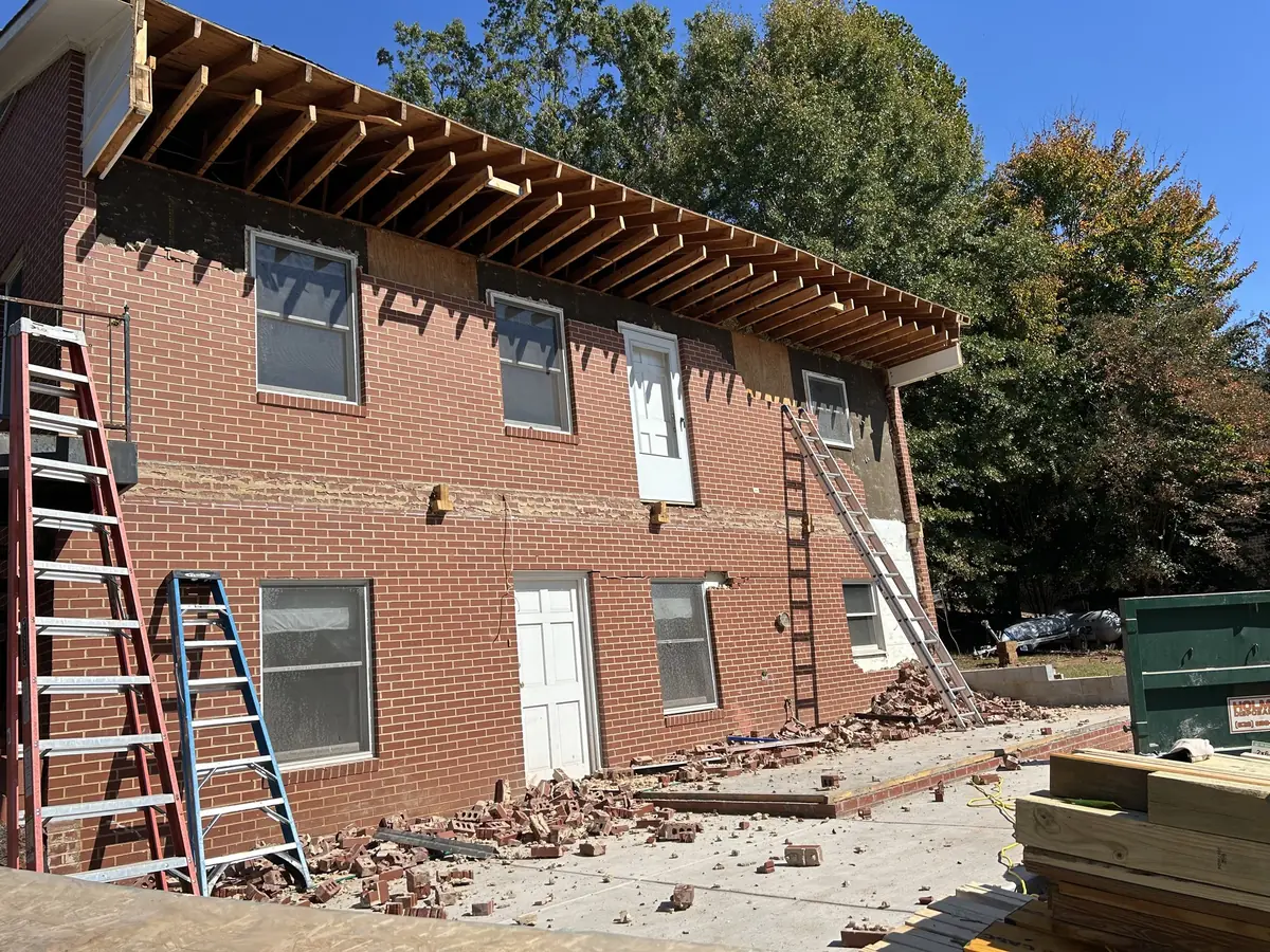 Brick house being taken down during a demolition job