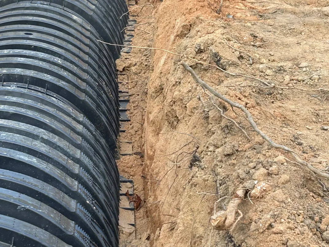 Close view of drain field chambers set against the trench wall, drain field repair