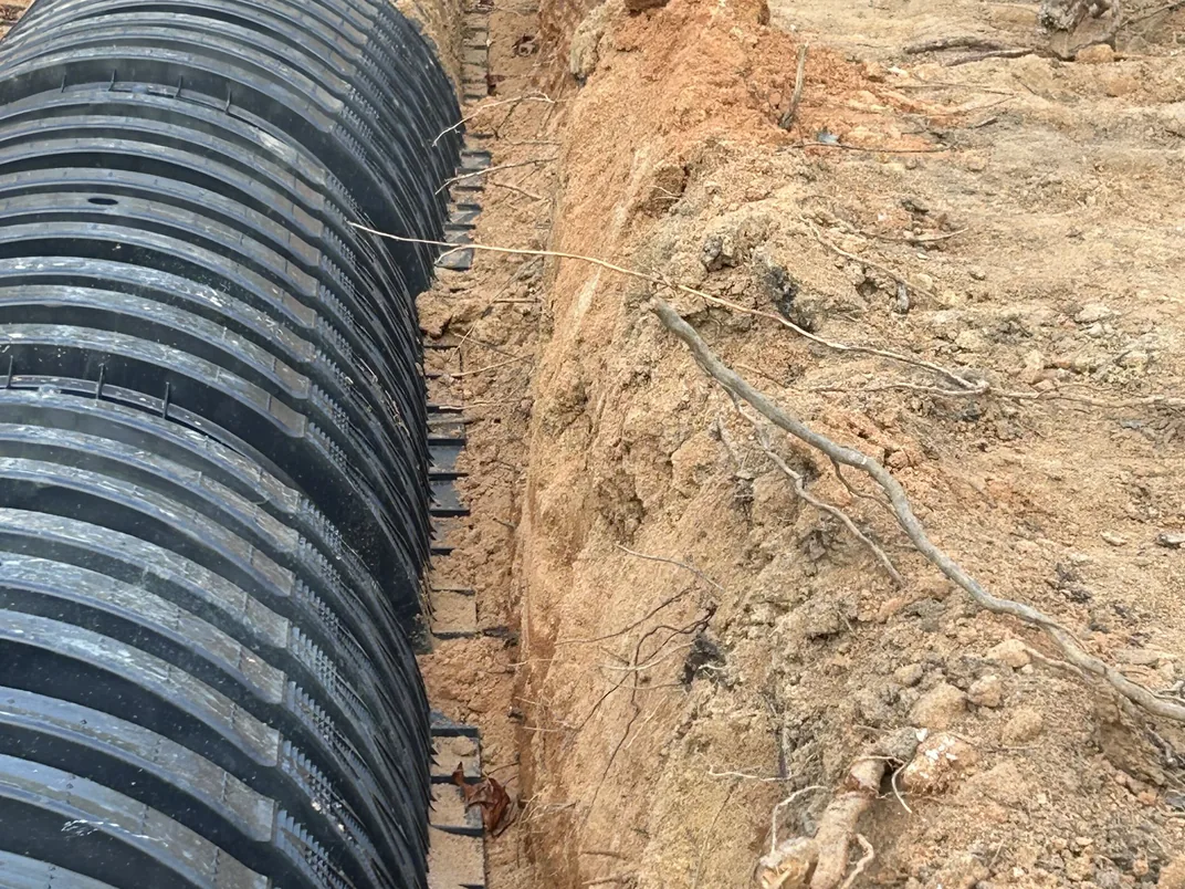 Drain field chambers set in a sandy trench, septic system replacement